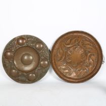 2 Art Nouveau copper chargers, in Newlyn and Keswick style, unmarked, largest diameter 44cm (2)