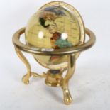 A reproduction terrestrial globe on stand of small size, height 37cm