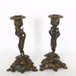 A pair of cast-bronzed candlesticks, with figural columns, height 25cm