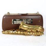 A brass lacquered World saxophone, serial no. 24561, in hardshell case
