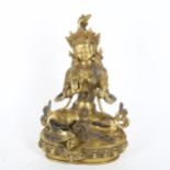 A polished bronze stone set seated Buddha, on lotus base, height 22cm