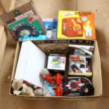 A box of various toys and games, including a Thomas The Tank Engine carry case with various