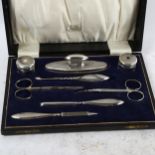 An early 20th century 8-piece engine turned silver manicure set, in fitted case