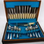 ERNEST C COCKBILL - a part-canteen of silver plated cutlery for 6 people, including carving set,
