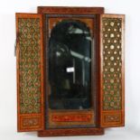 A finely detailed Moroccan shutter mirror, with hand painted and gilded decoration, height 67cm,