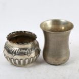 An embossed silver bowl, and an engine turned silver beaker (2)