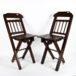A pair of child's stained oak folding chairs, height 65cm