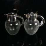 A pair of large crackle glaze water jugs with silver plated mounts