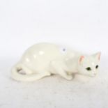 Just Cats, a prowling white ceramic cat with glass eyes, with black back stamp under, length 35cm