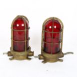 A pair of brass-mounted red glass ship's bulkhead lamps, length 22cm