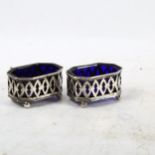 A pair of miniature pierced silver salts, with Bristol blue glass liners
