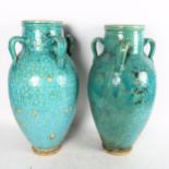 A pair of large Hamadan turquoise glaze pottery oil jars (1 A/F), height 54cm