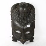 A large African Tribal carved hardwood ceremonial mask, height 55cm
