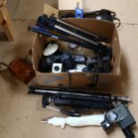 A quantity of Vintage cameras and other accessories, to include 3 tripods, a Canon C-8 grip cine