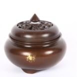 A Chinese gold splashed patinated bronze censer and cover, marks on base, diameter 10cm