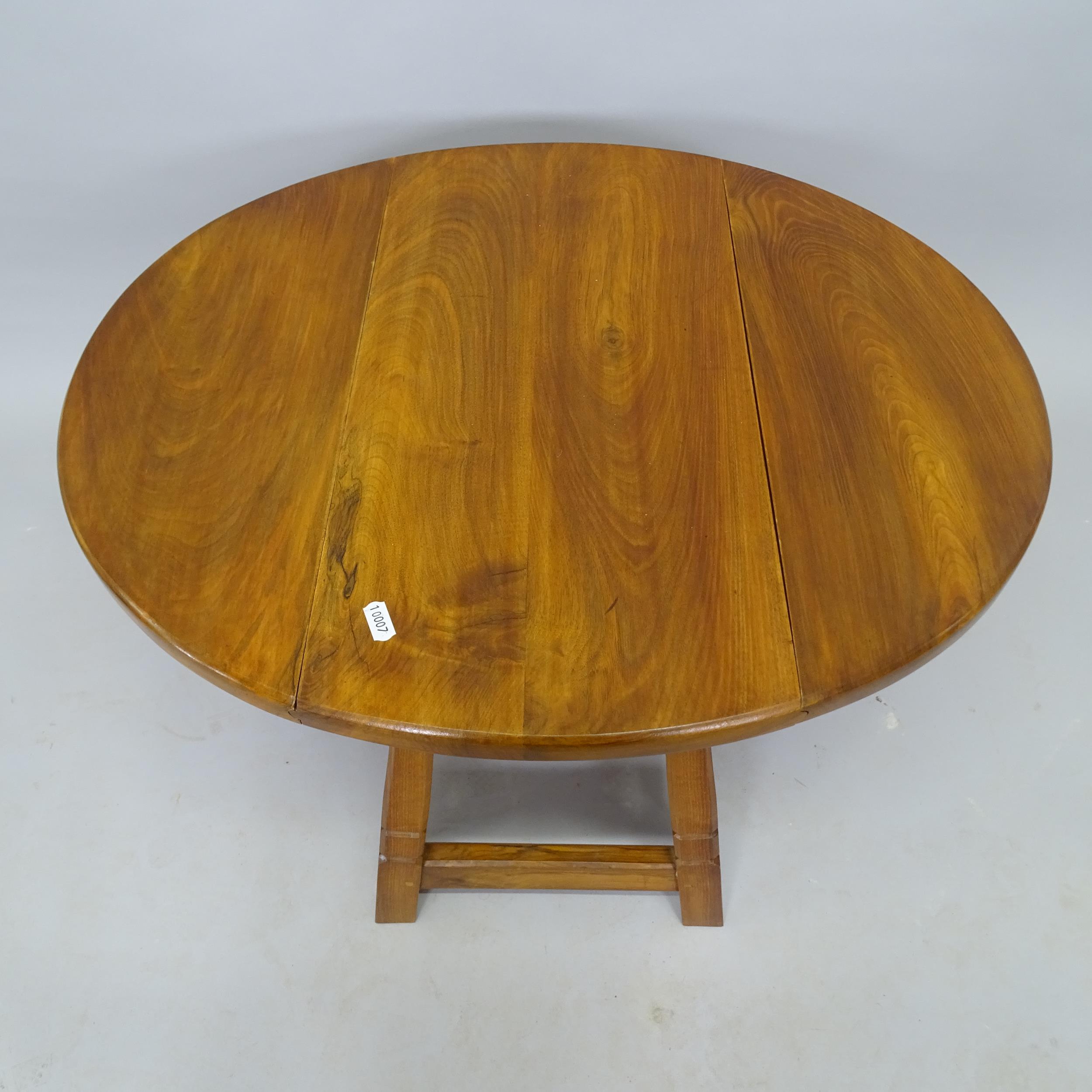 A mid-century elm oval drop leaf table, 54cm x 42cm x 30cm - Image 2 of 2