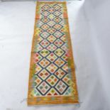 A Chobi Kilim runner, 250cm x 79cm