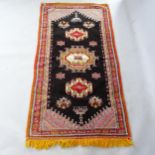 A Moroccan Berber rug, 207cm x 103cm