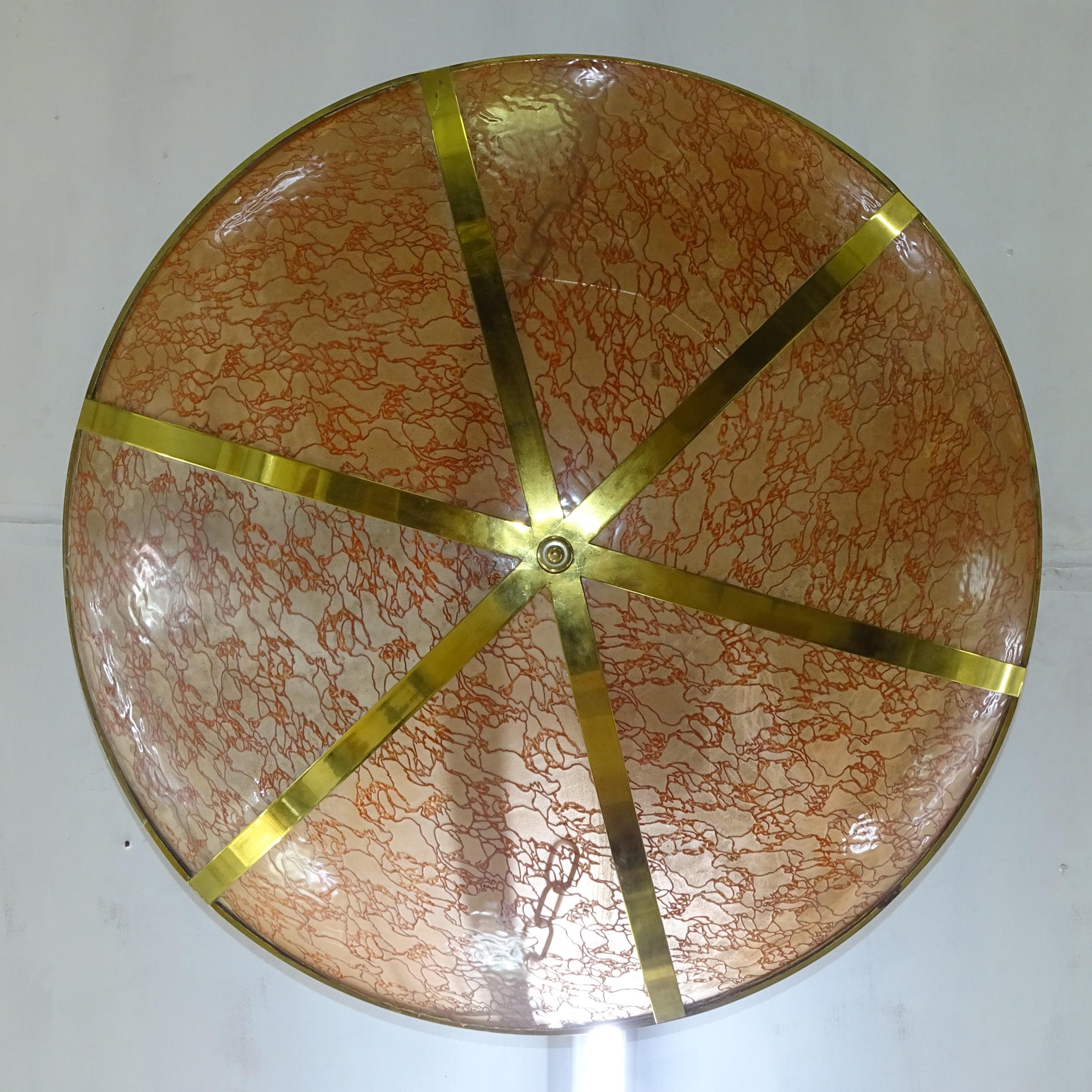 A French Art Deco ceiling light with brass frame and peach glass bowl, D95cm