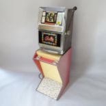 Bally one-armed bandit fruit machine on stand, overall 47cm x 149cm x 57cm