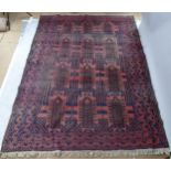 A red ground Afghan carpet, 295cm x 210cm