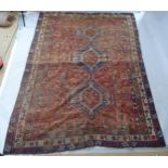 A red ground Qashqai carpet, 270cm x 192cm
