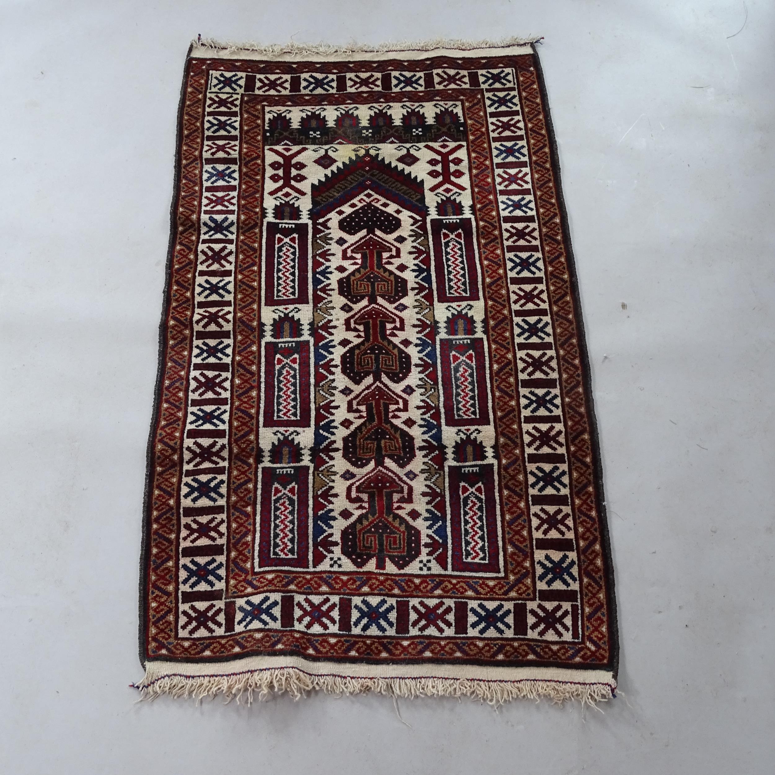 A red and cream ground Afghan prayer rug, 150cm x 83cm