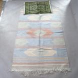 A Kilim rug, 200cm x 130cm, and a small Indian silk mat