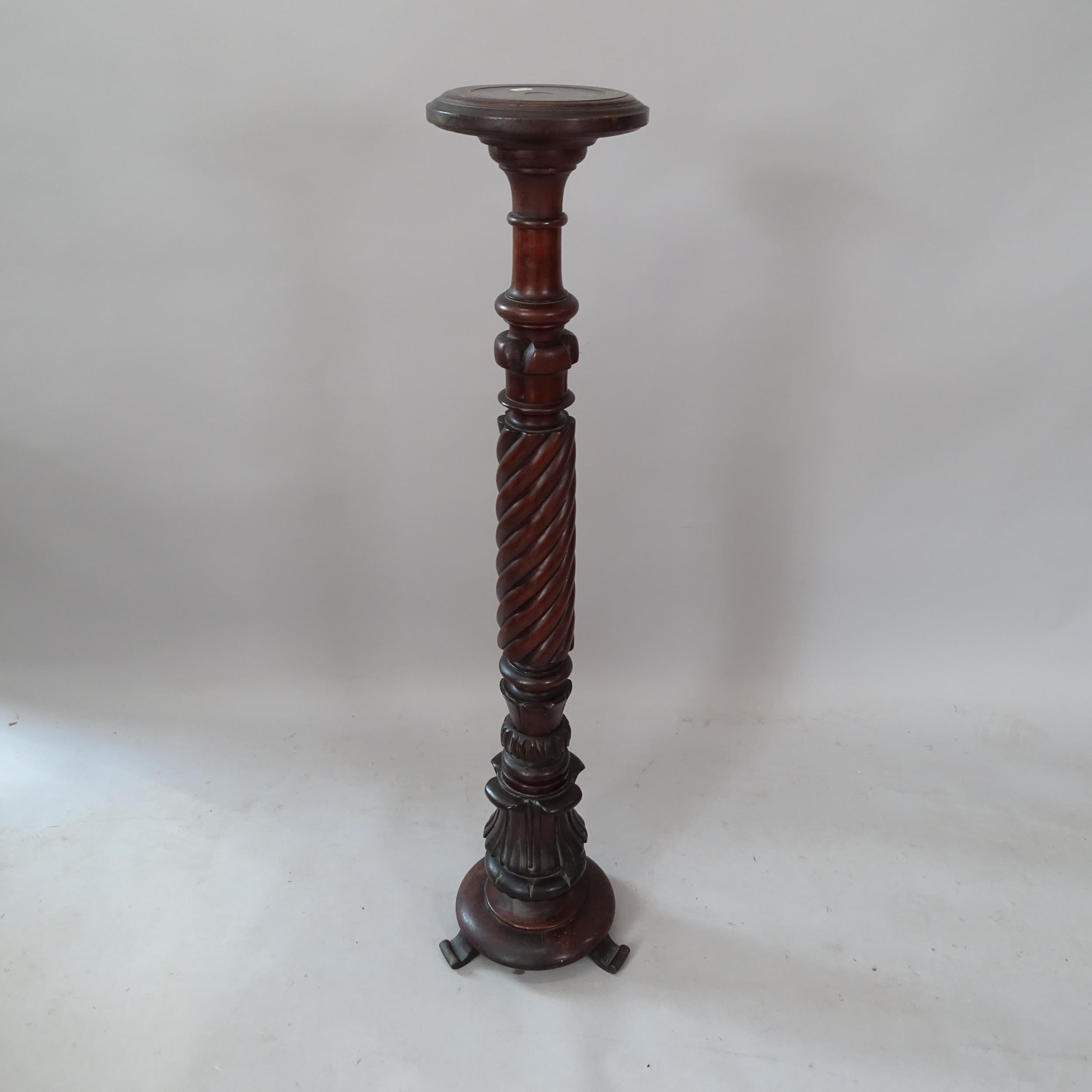 A reproduction mahogany torchere, 24cm x 118cm