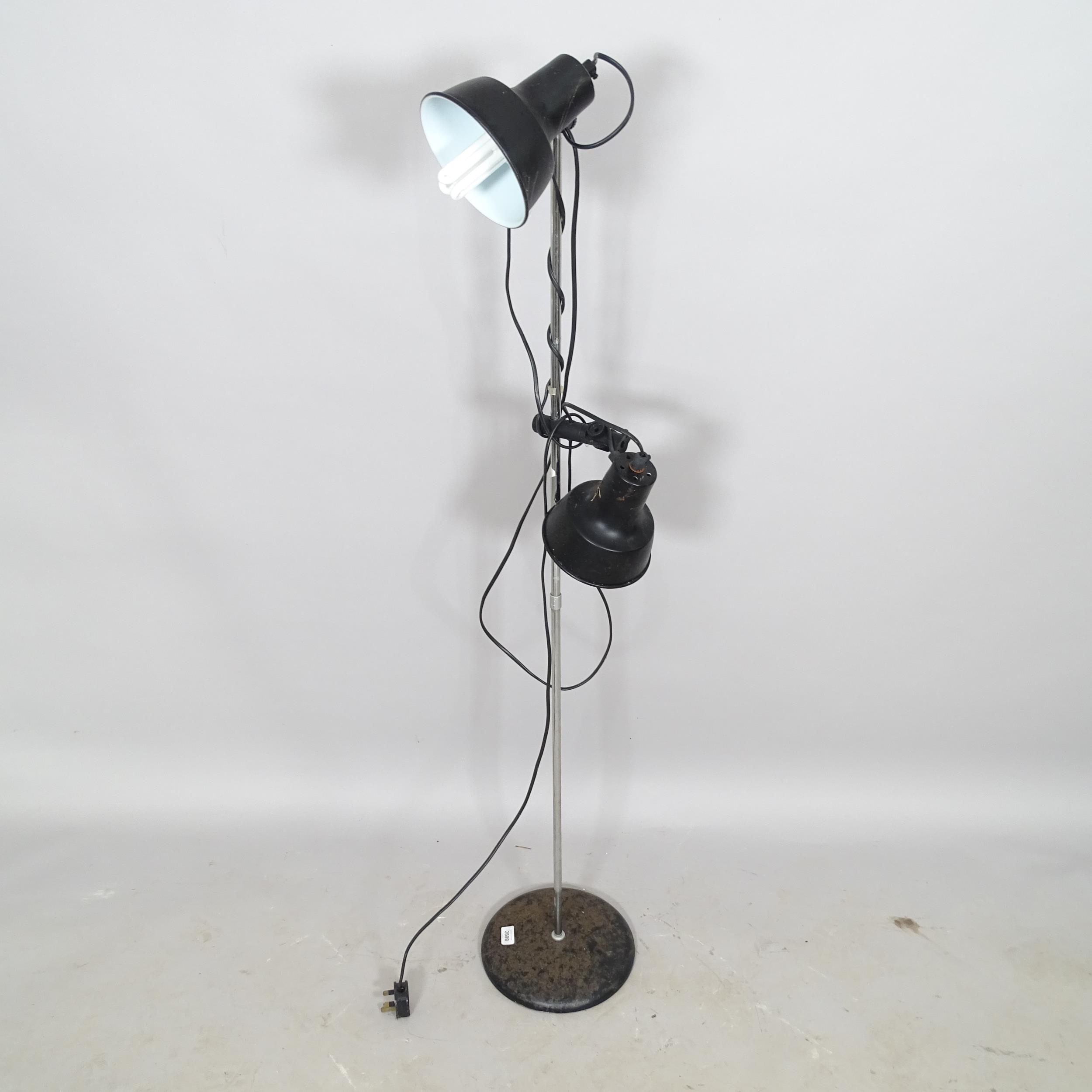 A mid-century floor lamp, with 2 adjustable lights