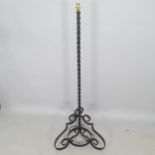 A wrought-iron standard lamp, height to bayonet 150cm