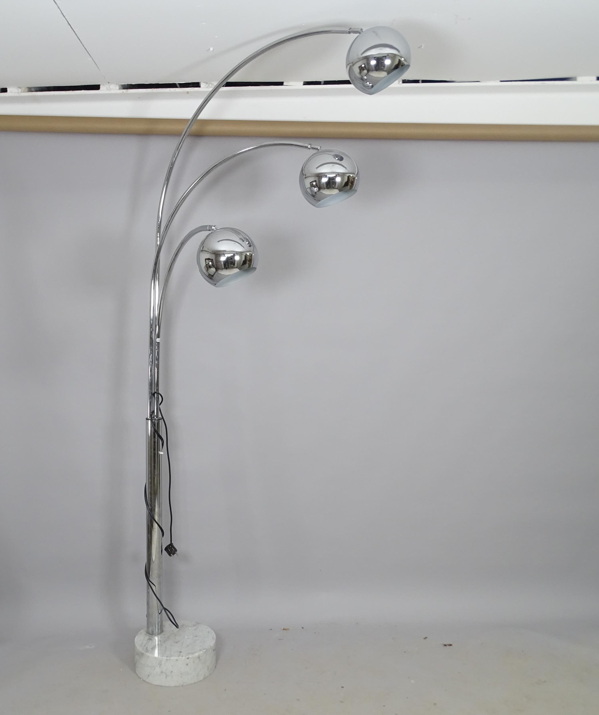 A mid-century design chrome triple arc lamp, on marble base, H210cm