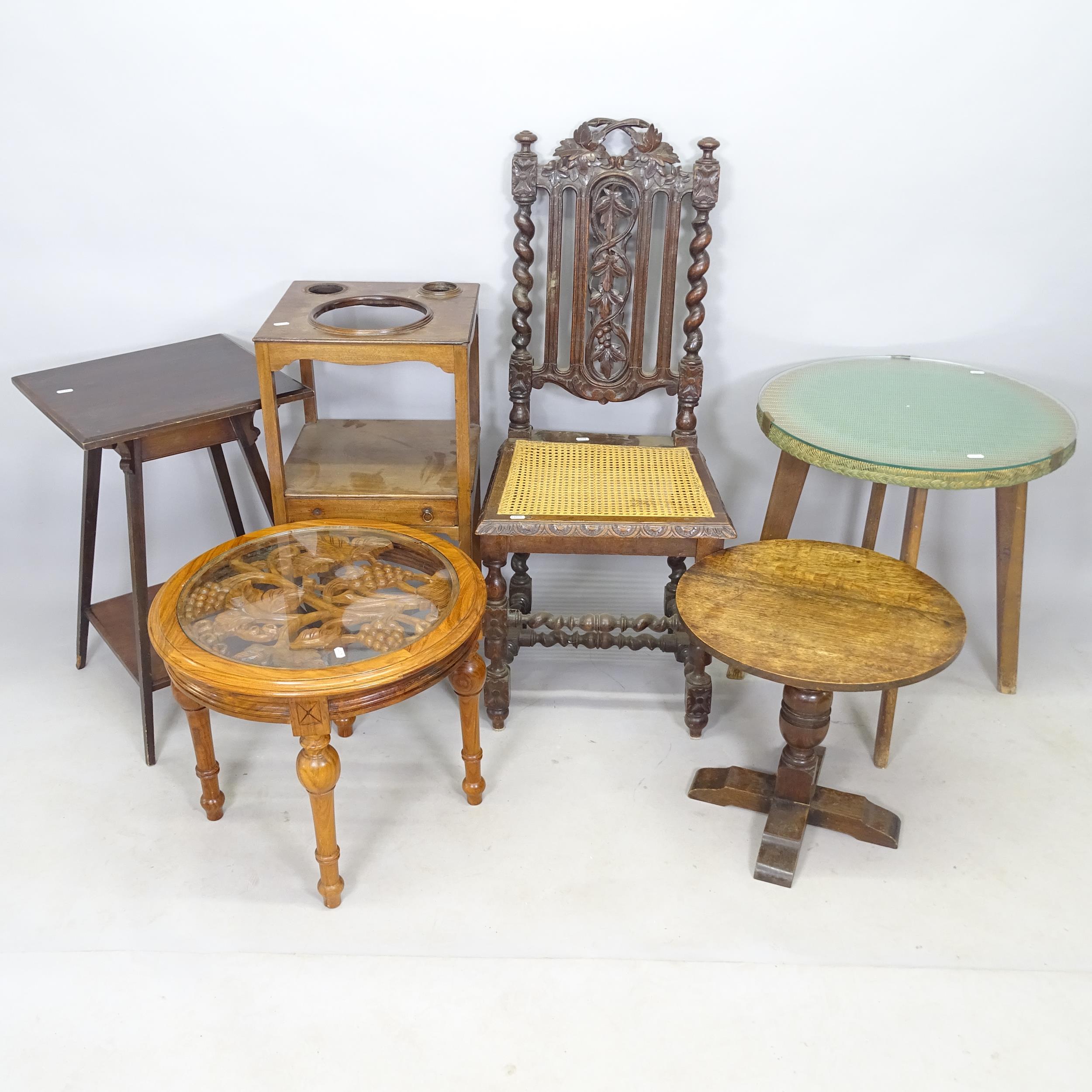 A carved oak hall chair with cane seat, an oak circular-top lamp table, a mahogany jardiniere