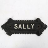 A cast-iron plaque, "Sally", length 32cm