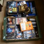 2 boxes of various DVDs