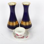 A pair of KPM blue and gold vases, 18cm, and a Meissen cabinet cup and saucer