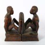 A pair of African Tribal carved hardwood figural bookends, height 25cm