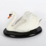 A Franklin Mint fine bisque porcelain 'The Royal Swan' figure, by Ronald Van Ruyckevelt, on