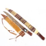 2 African short swords, with woven leather and hide scabbards, longest 67cm