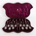 A cased set of early 20th century silver plated teaspoons, with cherub finials and spiral handles,