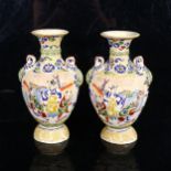 A pair of Japanese Satsuma vases, with embossed enamelled decoration, height 22cm