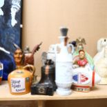 Various novelty spirit bottles, including Michter's Sour Mash Pot Still Whiskey, and other novelty