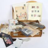 A suitcase full of loose stamps, postcards etc