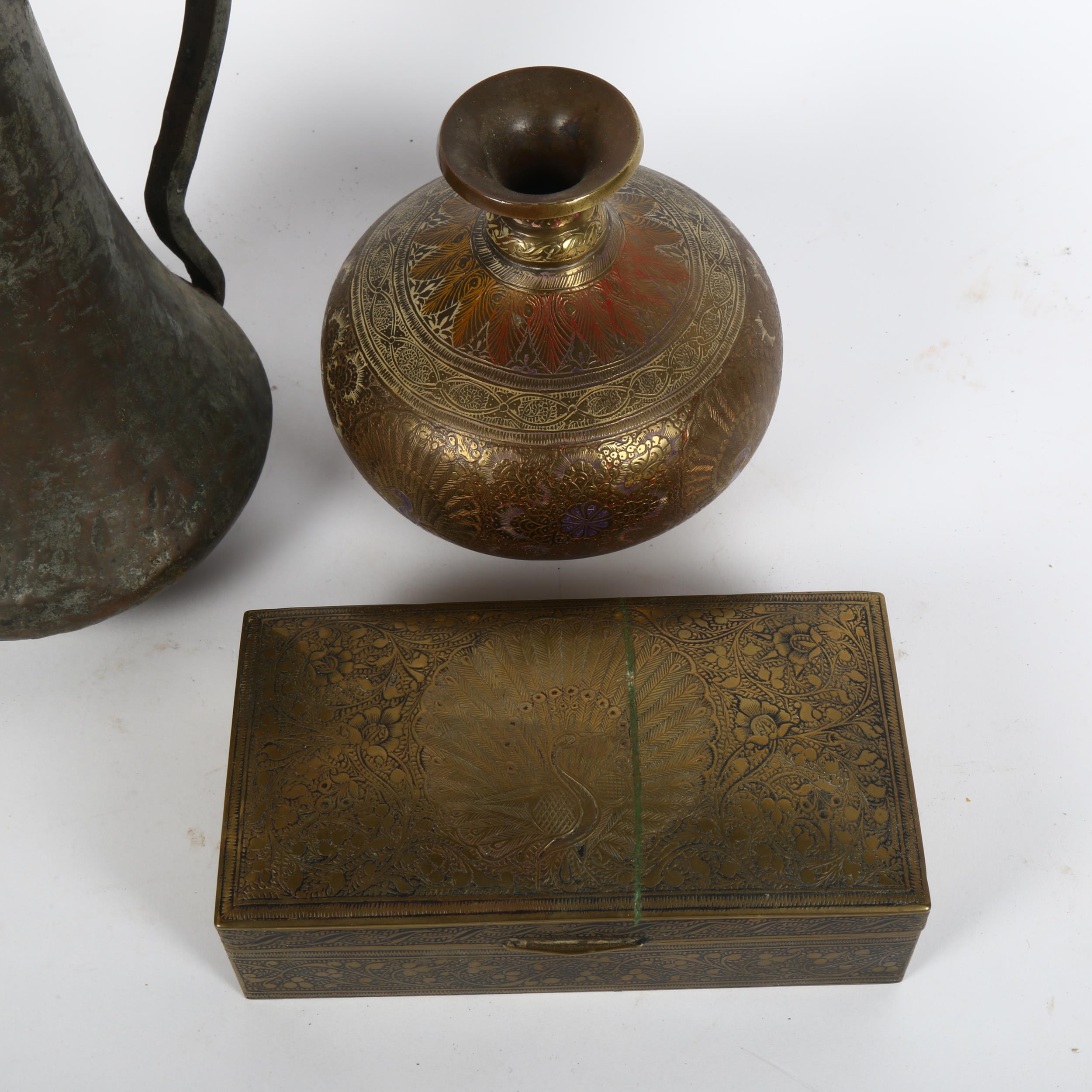 A Turkish brass wine ewer, engraved brass peacock cigarette box, and vase, height 13cm (3) - Image 2 of 2