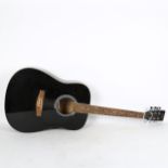 A black C Giant 41' Western acoustic guitar