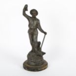 A spelter figure of a man with a pickaxe, on plinth, 33cm