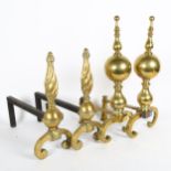 A pair of ornate brass andirons, height 47cm, and a pair of brass and steel andirons