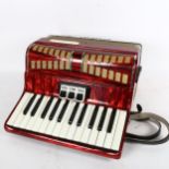 A Lyra piano accordion, cased, various tutorial ephemera and music posters of Roy Wood and Wizard