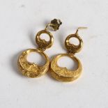 A pair of unmarked yellow metal double-hoop pendant earrings, with scrolled engraved decoration, 3.