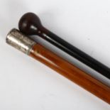 A Malacca walking cane with white metal top, and another ebonised cane, largest length 113cm (2)